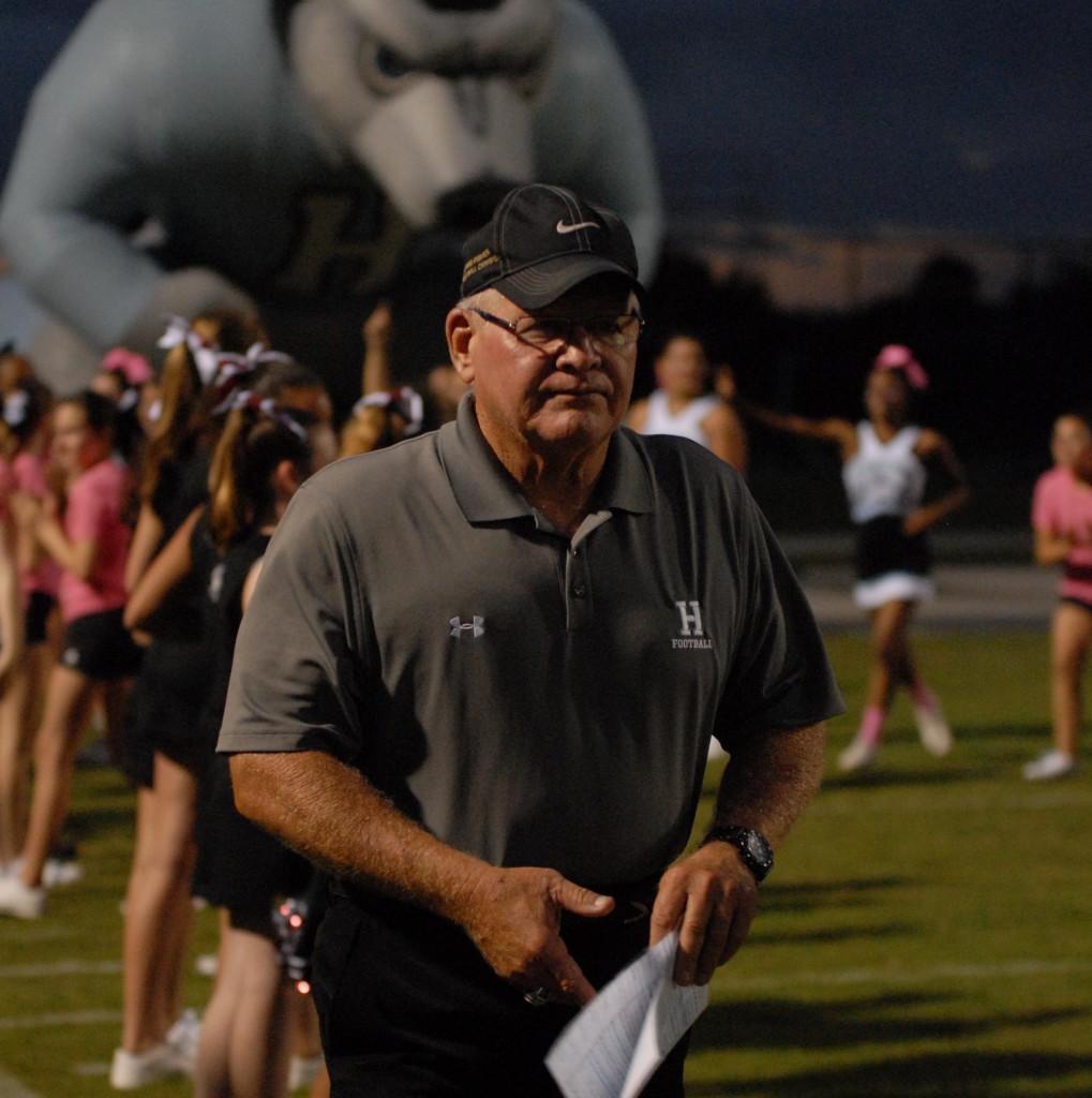 Coach Phil Ziglar walks to the sideline as he has just run out of the Husky before the Pinkd game against University Orange City. Hagerty went on to win 24-21 in double overtime.