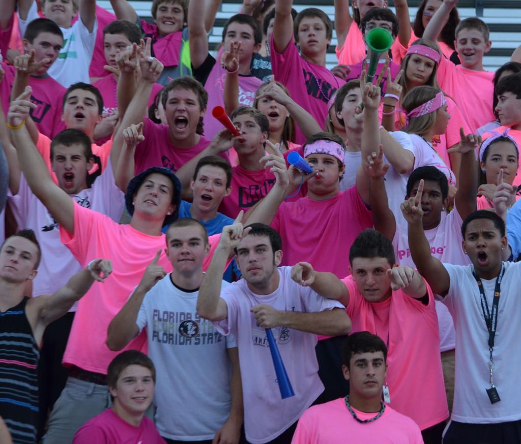 Fans gather to cheer on their football team against University High School at Orange City, as well as support the fight against breast cancer. 