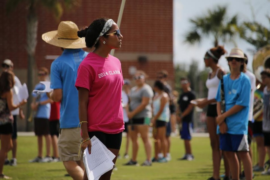 Drum major Isabella Guevara observes the marching band as they rehearse the routines for the Sep. 4 football game. “She voices her opinion a lot more when she’s on the field compared to the other [drum majors]. She’s the one who gets everyone on task,” Caleb Schaefer said.