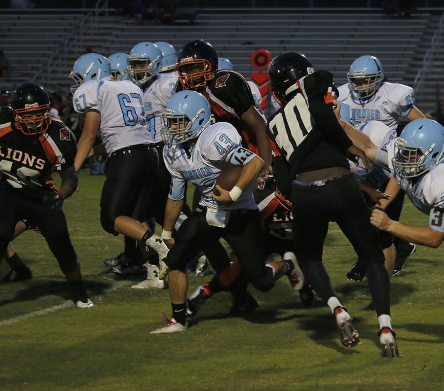 Running back Oliver Hart takes it between the tackles on a carry in a 31-0 win over Oviedo.  