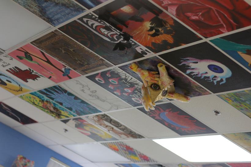 Mix of 2D and 3D art tiles on the ceiling of the art room