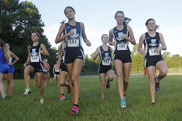 The+girls+team+warms+up+for+the+Oct.+24+District+Championship+meet+in+Deland.+
