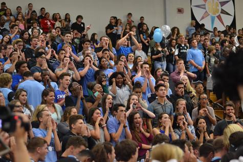 Juniors cheer on as the seniors turn their back during the competition for the spirit stick.