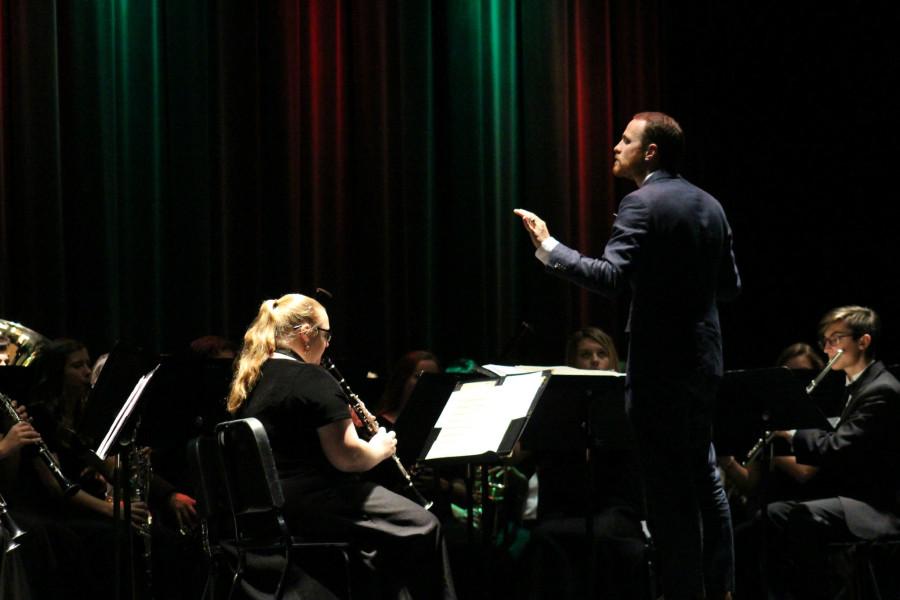 Band director Brian Kuperman conducts the band for the classic Christmas song Jingle Bells on Friday, Dec. 4 for their annual Rhapsody in Blue concert. 