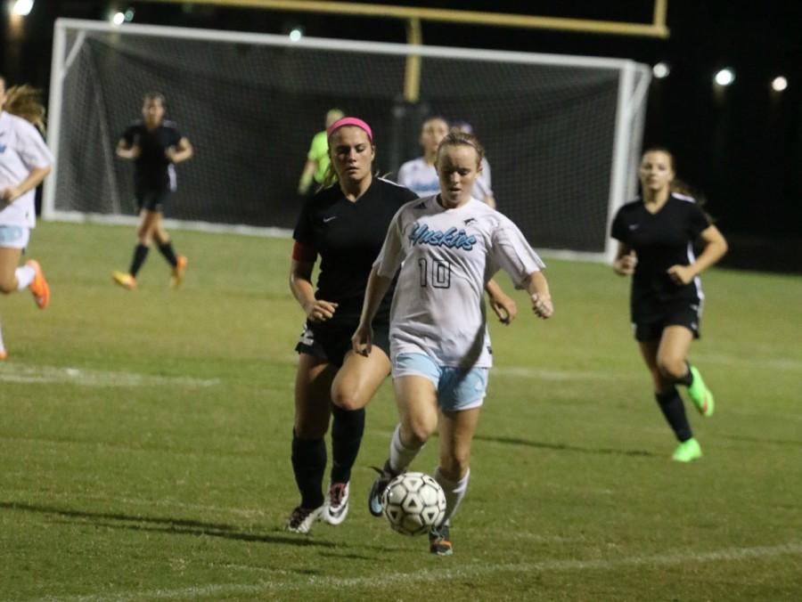 Center back Meghan Precord drives the ball across the field during a game against Lake Mary on Nov. 10. 