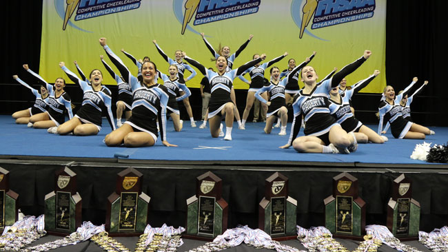 Cheer strikes a pose after performing in the state finals competition on Jan. 30 at USF’s Sun Dome. The team, which was scored based off of execution and  routine difficulty, scored a record 92.45 points, the highest score ever awarded in the state competition. 