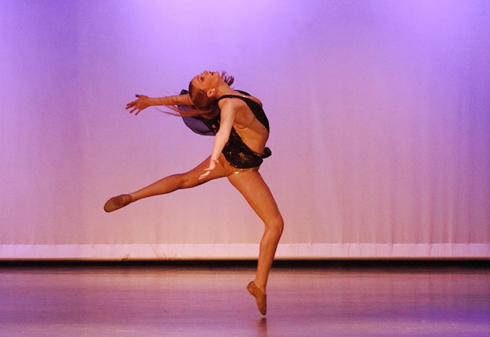 Dance+student+performs+a+lyrical+solo+at+the+March+17+show.+