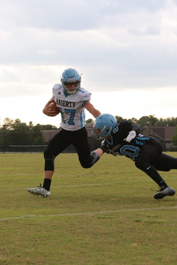 Quarterback Matt Lipari avoids a defender in the Black and Blue Scrimmage game on Friday, May 13. The blue team went on to win 17-7.
“We now feel prepared for Oviedo,” Lipari said. 