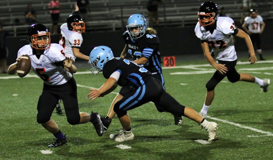 Defensive back Jackson Scott sacks Oviedos quarterback. The defense only allowed three first downs in JVs 31-0 victory.