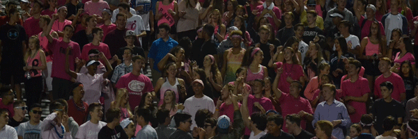 The student section cheers after a major play during the Pink’d game. Varsity football won against Edgewater, 51-0. 
