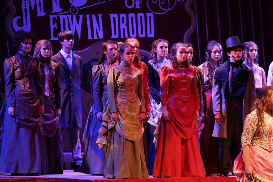 The cast of The Mystery of Edwin Drood stands together during a scene during their dress rehearsal on Wednesday, Nov. 3. Night rehearsals like this one were frequent and mostly done the week of and before the opening night. 