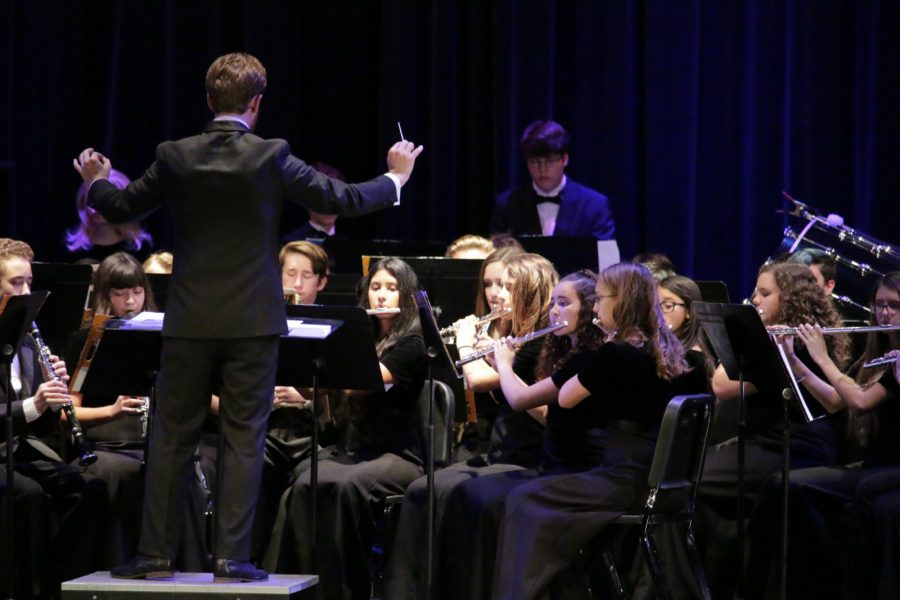 Band director Brad Kuperman conducts the band for a performance on stage for the annual Rhapsody in Blue concert on Friday, Dec. 2. 