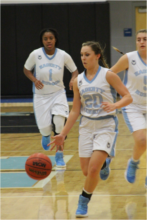Aryann Johnson, Tori Munro and Cailyn Muglach all strive to score at their game against Melbourne on Jan. 11. 
