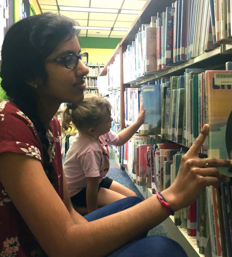 Sophomore+Devaki+Sharma+volunteers+at+the+Seminole+County+Public+Library.+Sharma+volunteered+every+Wednesday+for+four+hours.