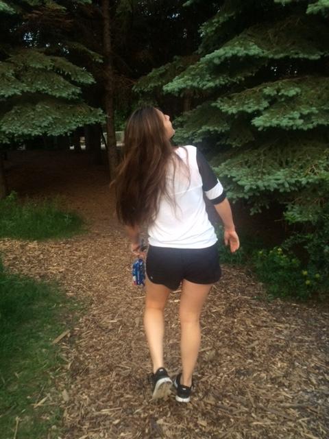 Senior Erika Grasso walks through a forest during one of her past trips to Winnipeg, Canada. 