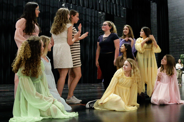 The cast members practice the fairy scene for the play A Midsummer Nights Dream.  The costume crew made all of the costumes for the play. 