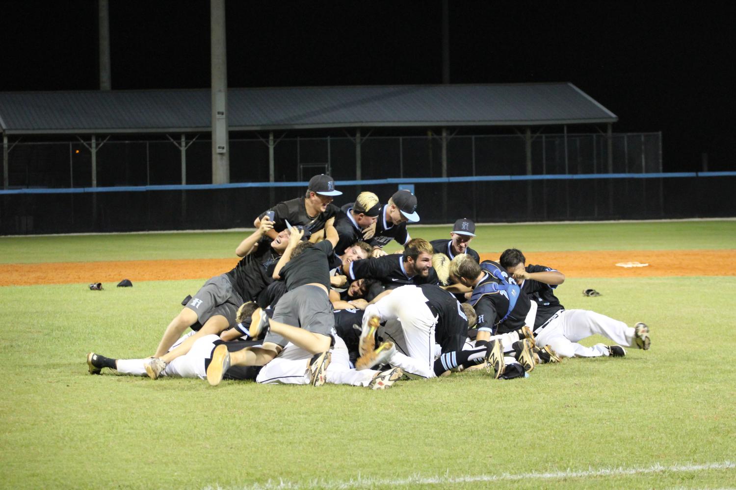 The baseball team celebrates after a 6-2 win in the regional final against George Jenkins. The team will play in the state semifinals on Friday, June 2 against Sarasota in  Fort Meyers. 