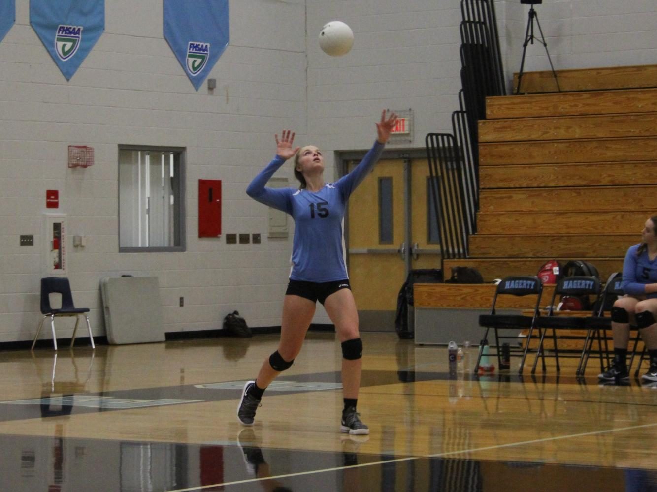 Middle Sydney Conley serves the ball vs. Oviedo. The team lost 3-1.