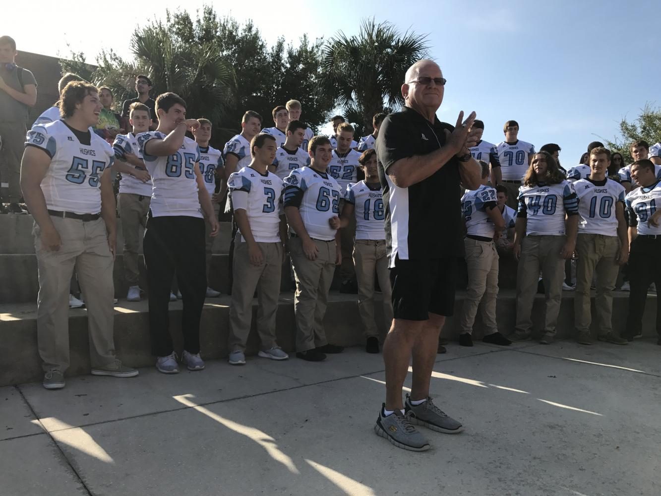 Head coach Phil Ziglar stands with the football team in the amphitheater during the mini-pep rally. They take on Oviedo Thursday at 7 p.m.