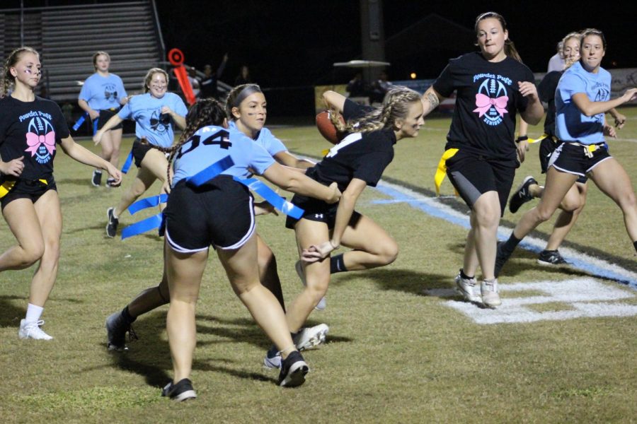 Senior Rachel Robbins fights through the crowd. She scored two touchdowns during the game. 