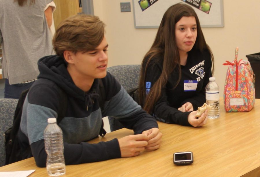 Junior Cooper Kirk and student ambassador Madyson Johnson converse with other students attending the Sit with Us lunch. 