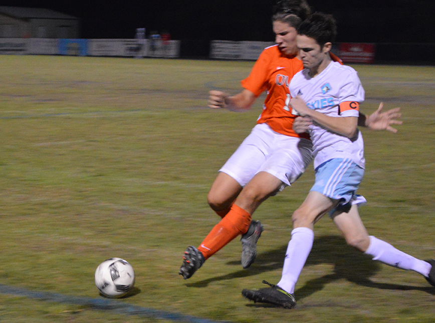 Nick Moreschi fights for the ball in the game against Oviedo. Moreschi was pushed to the track in a physical game that Hagerty won, 3-1. 