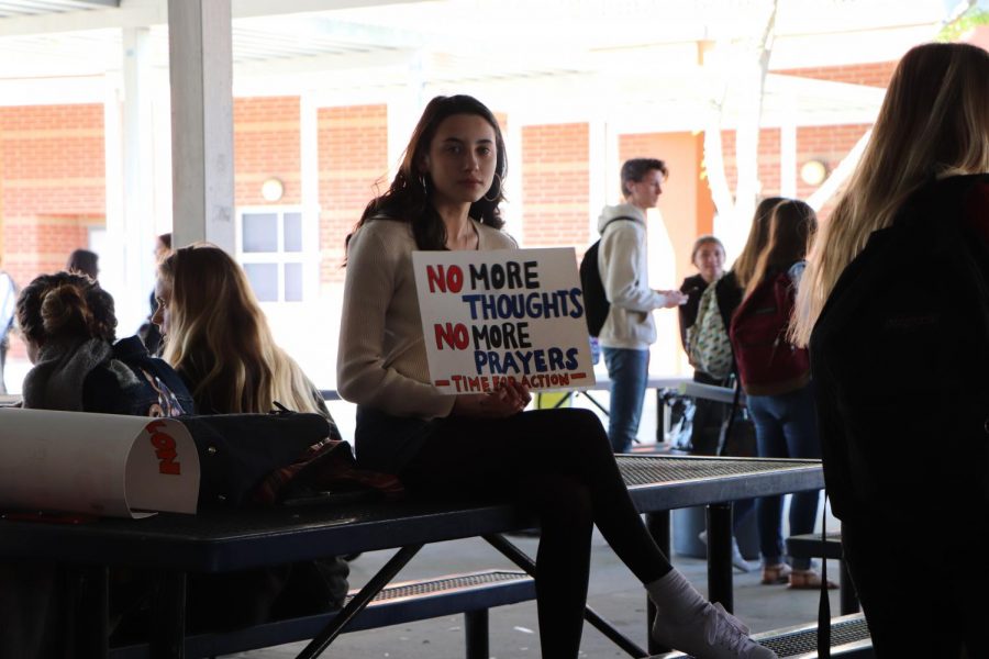 Junior Gabriela Marcum participates in the protest by sitting silently, remembering the lives lost. 
