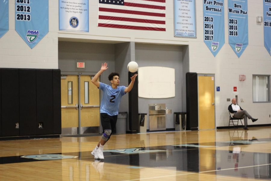 Outside hitter Victor Jerez serves the ball against Lake Mary. The team lost 3-0 and is now 2-2 for the season.