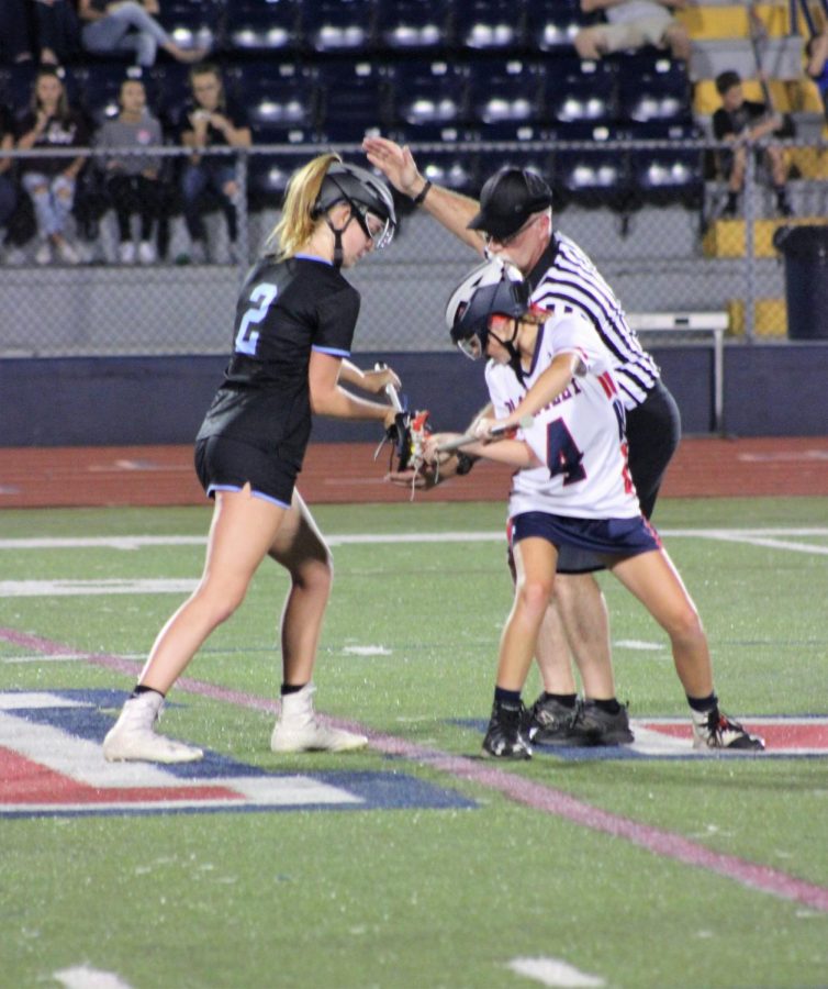Midfielder Katie Williams sets up for a face off against Lake Brantley. The girls won 12-1, securing their spot in the SAC Championships.