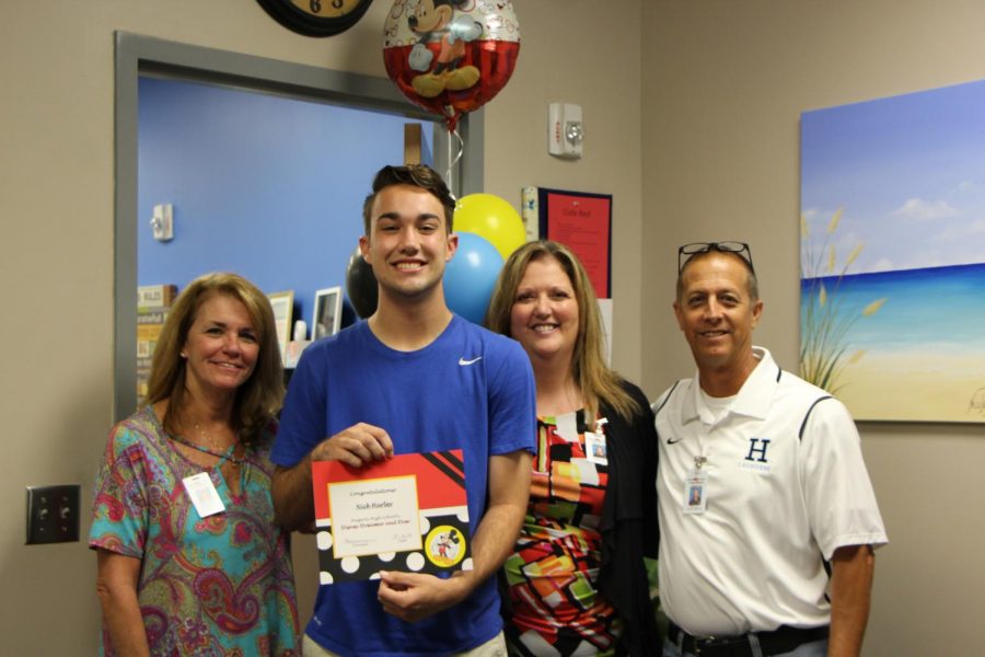 Senior Nick Hurley poses with Student Services and Administration. He won the Disney Dreamer and Doer award.