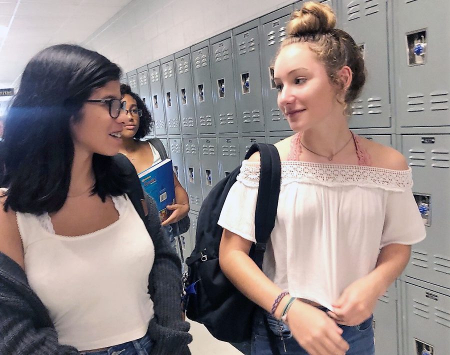 Elizabeth Aritza and Leeann Andrews leave their Creative Writing midblock class. While off the shoulder tops were not allowed last year, this year they are. 