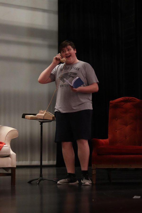 Male lead, Oscar, played by junior Jake Lippman, rehearses the scene where his daughter and ex-wife call him during a poker game. 