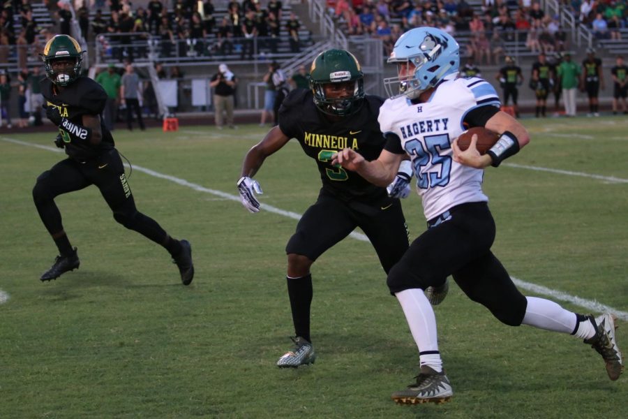 Wingback D.J.  McCunney tries to outrun Lake Minneola defenders on the sideline.  McCunney rushed 7 times for 46 yards and a touchdown in Hagertys 35-28 win over Lake Minneola.