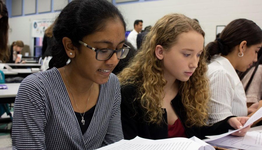 Sophomores Emily Grossenbaugh and Roshna Cherugail practice their case work before the tournament.  Grossenbaugh and Cherugail were partners in the public forum and received first place in the division. 