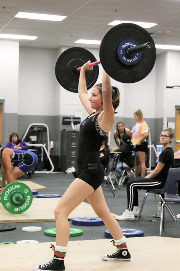Sophmore Daryn Miller on her second clean and jerk attempt during a match against Lyman.