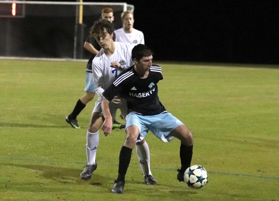 Outside midfielder Evan Sorace maintains possession against a Lyman defender. Sorace scored on a penalty kick to help the team to a 4-0 shutout. 