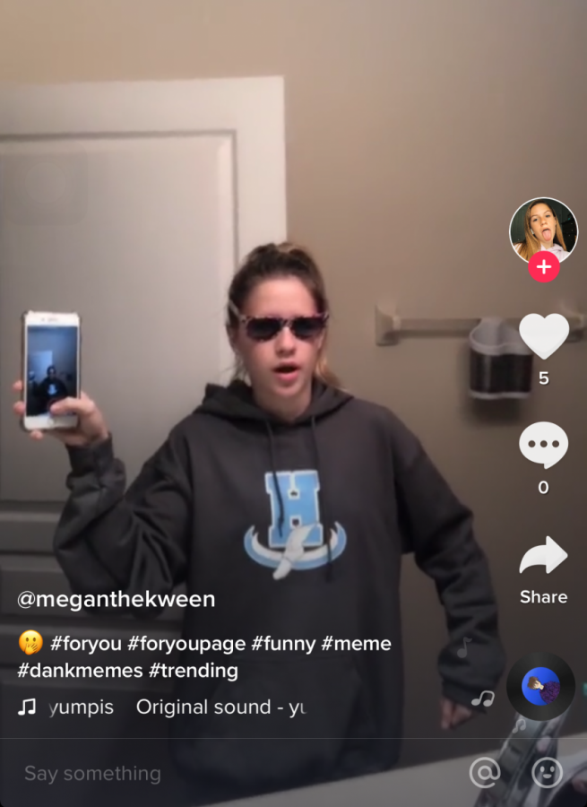 Freshman Megan Lundstrom  recreates a TikTok meme from user Yumpis. TikTok allows users to pick their own sound, which could be another TikTok. This feature gives users like Lundstrom, freedom to use their originality to recreate trending TikToks. 