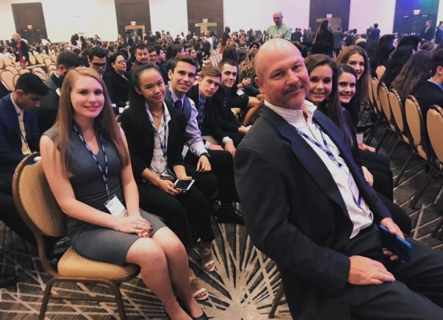 DECA club awaits for the awards ceremony to start. Last year, only three members of the club qualified for states and attended, but, this year, DECA tripled their members, with nine students who attended and four award winners. 