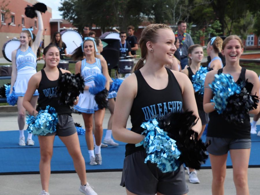 Cheerleaders and dance team members perform during the Husky Huddle on Aug. 30. Principal Robert Frasca has planned to make spirit events like this more of a regular thing.