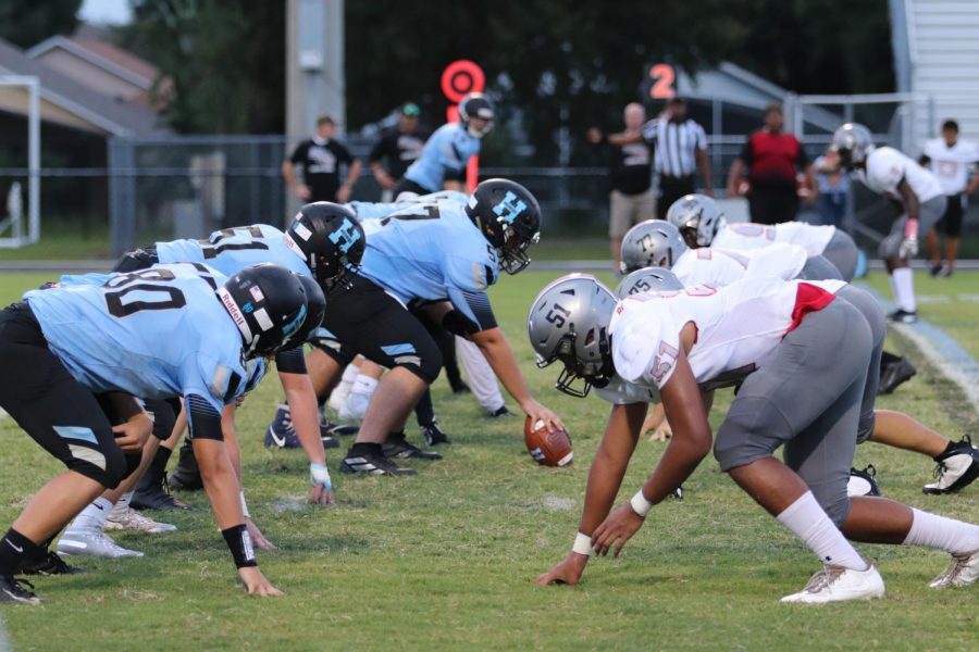 Both the offensive and defensive lines for Hagerty and Gateway respectively line up on the line of scrimmage, getting ready to rush the other side. Hagerty would go on to win 23-0.