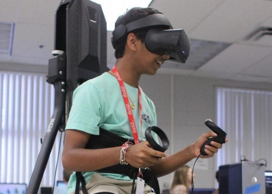 Junior Saagar Shah uses the KAT Walk VR to play a game he created. In June 2019, the Hagerty Modeling and Simulation program won $3,000 in new technology including the KAT Walk VR.