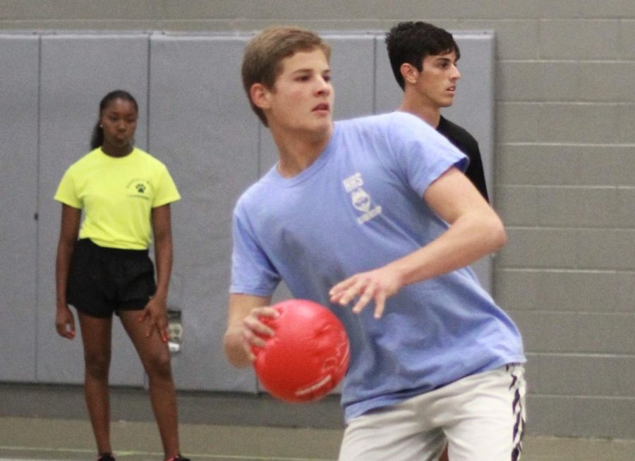 Junior Joshua Hobbs prepares to launch the dodgeball at the opposing team. Hobbs  favorite part of the game was the mini student section created for another dodgeball team.