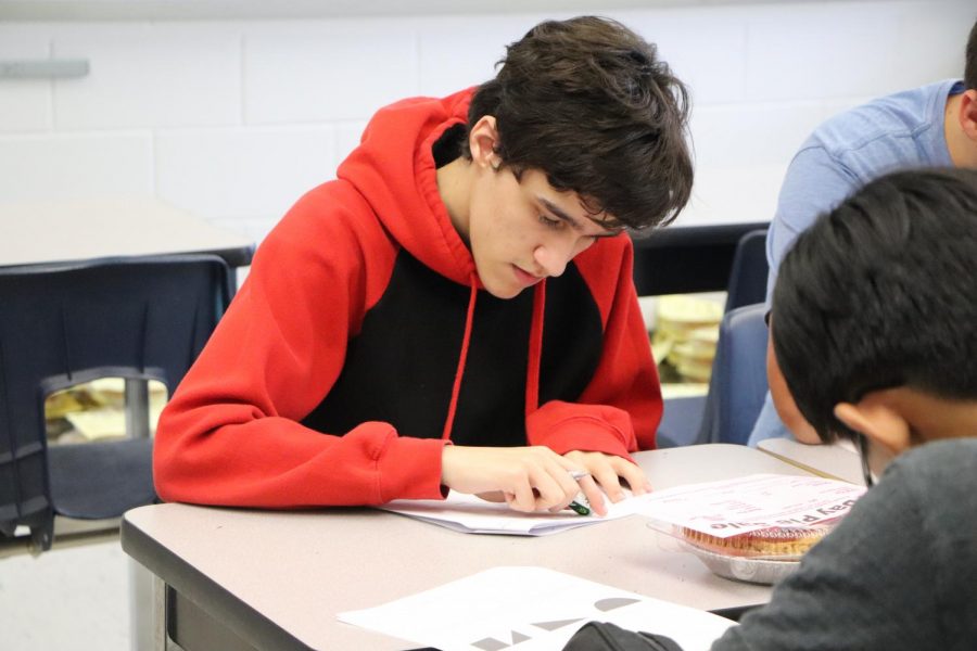 Senior Brian Gifford works on a test for AP Calculus after school.