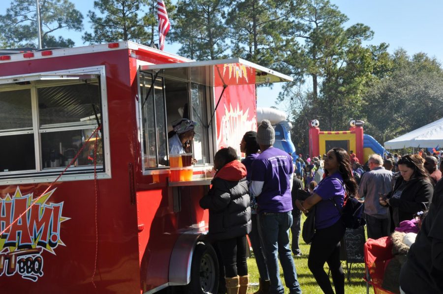 Many people lined up at many food trucks to get ice cream, italian ice, barbecue and more.