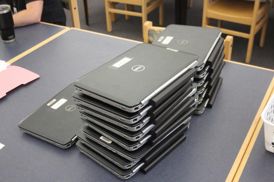 Laptops sit in the media center waiting for community members to pickup. SCPS staff passed out Hagerty laptops to students from elementary, middle and high school students from schools across the county.