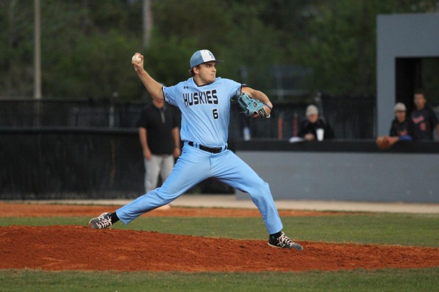 Junior pitcher Trent Caples pitches in a 3-0 win against Oviedo on March 13. The win was the last game any sports team played since COVID-19 shut down schools and sports.