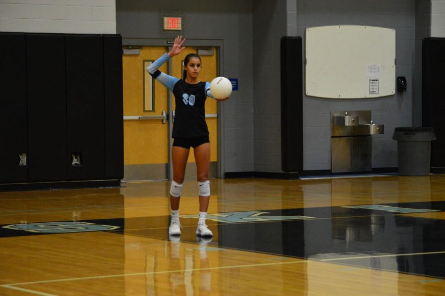 Freshman Sophia Marini sets the ball. The girls volleyball felt more confident going into their season after they defeated Lake Howell. 