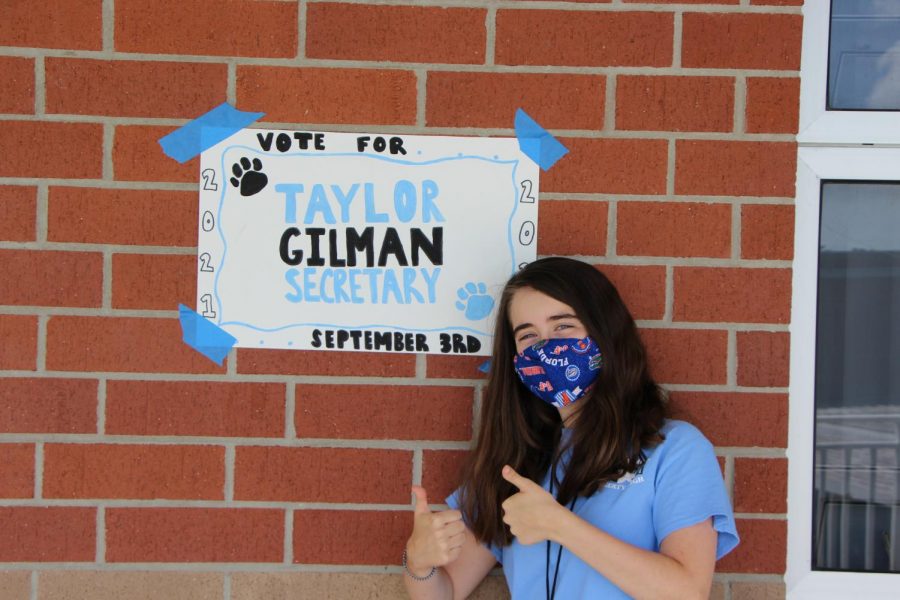 Taylor+Gilman+hanging+campaign+posters+to+encourage+this+years+seniors+to+vote+for+her.+