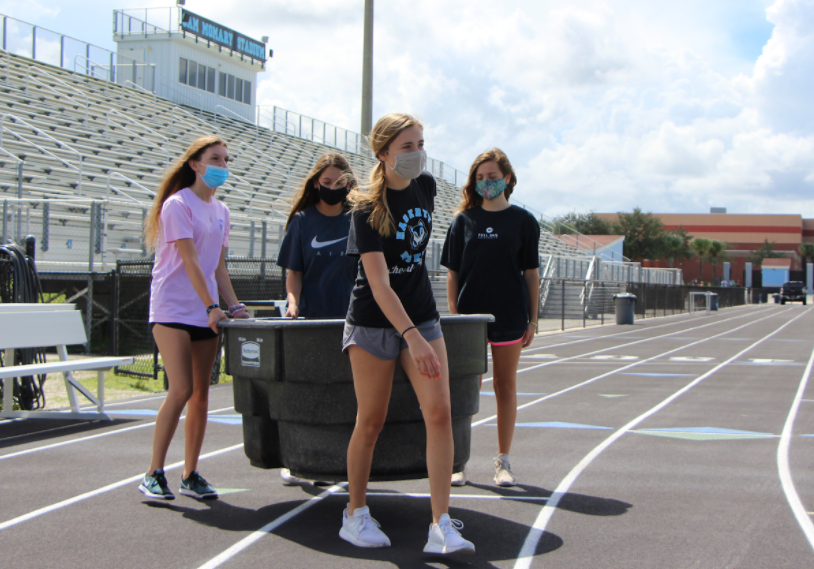 Junior Abigail Maxwell led the student athletic trainers to carry the cold-water immersion tub to the football field. 
