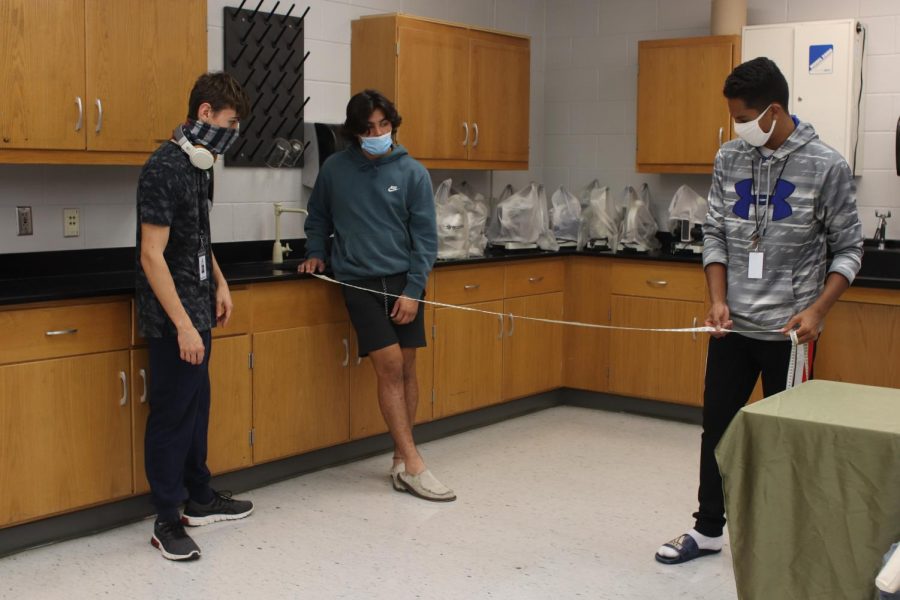Senior Robert Torres is completing a Forensics lab. The lab included a mock crime scene that students could interact with.